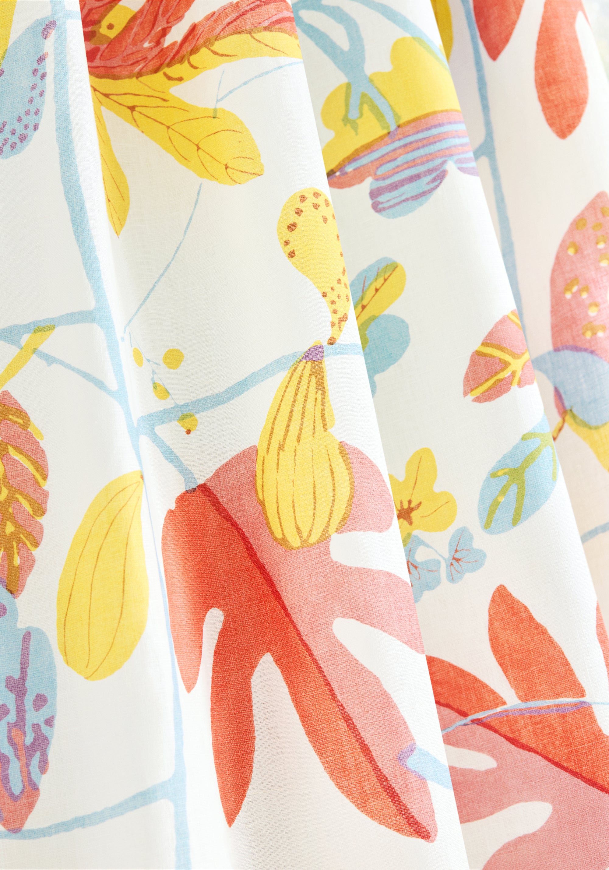 Close up of custom curtains made from Thibaut Matisse Leaf fabric in coral and yellow color - pattern number F916206