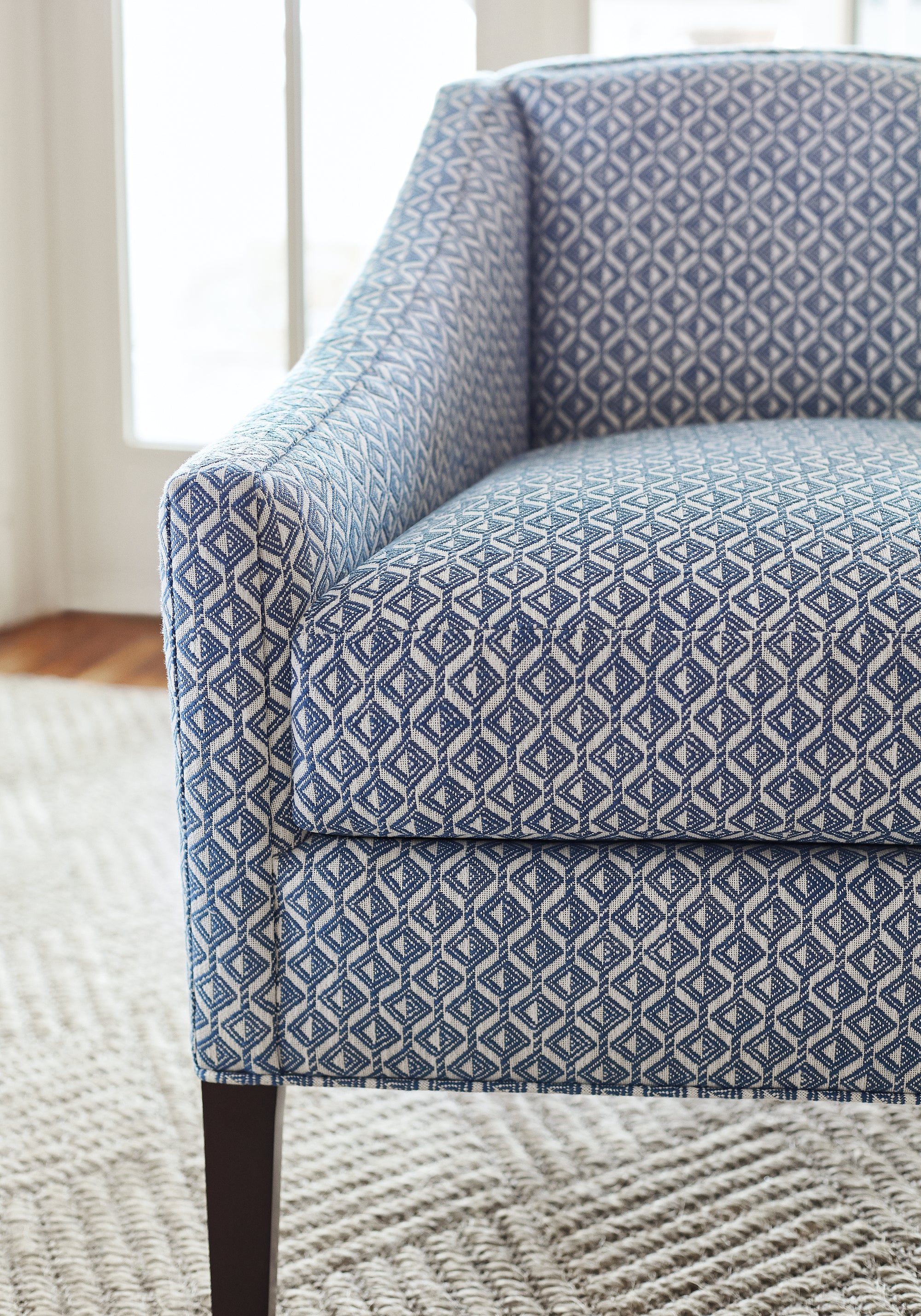 Detailed view of stain resistant Grayson Chair in Trion woven fabric in royal blue color variant by Thibaut in the Landmark collection - pattern number W73456