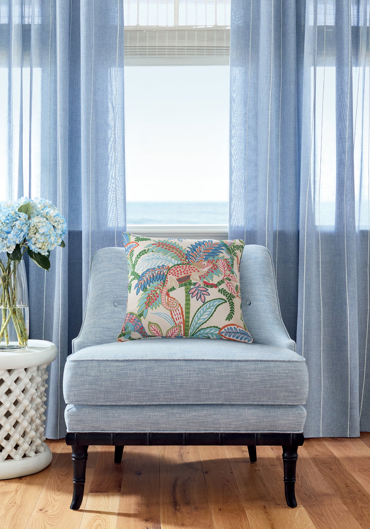 Pillow in Iggy fabric in island color - pattern number F81672 - by Thibaut in the Locale collection. Also pictured - Brentwood Chair in Finley woven fabric in Chambray