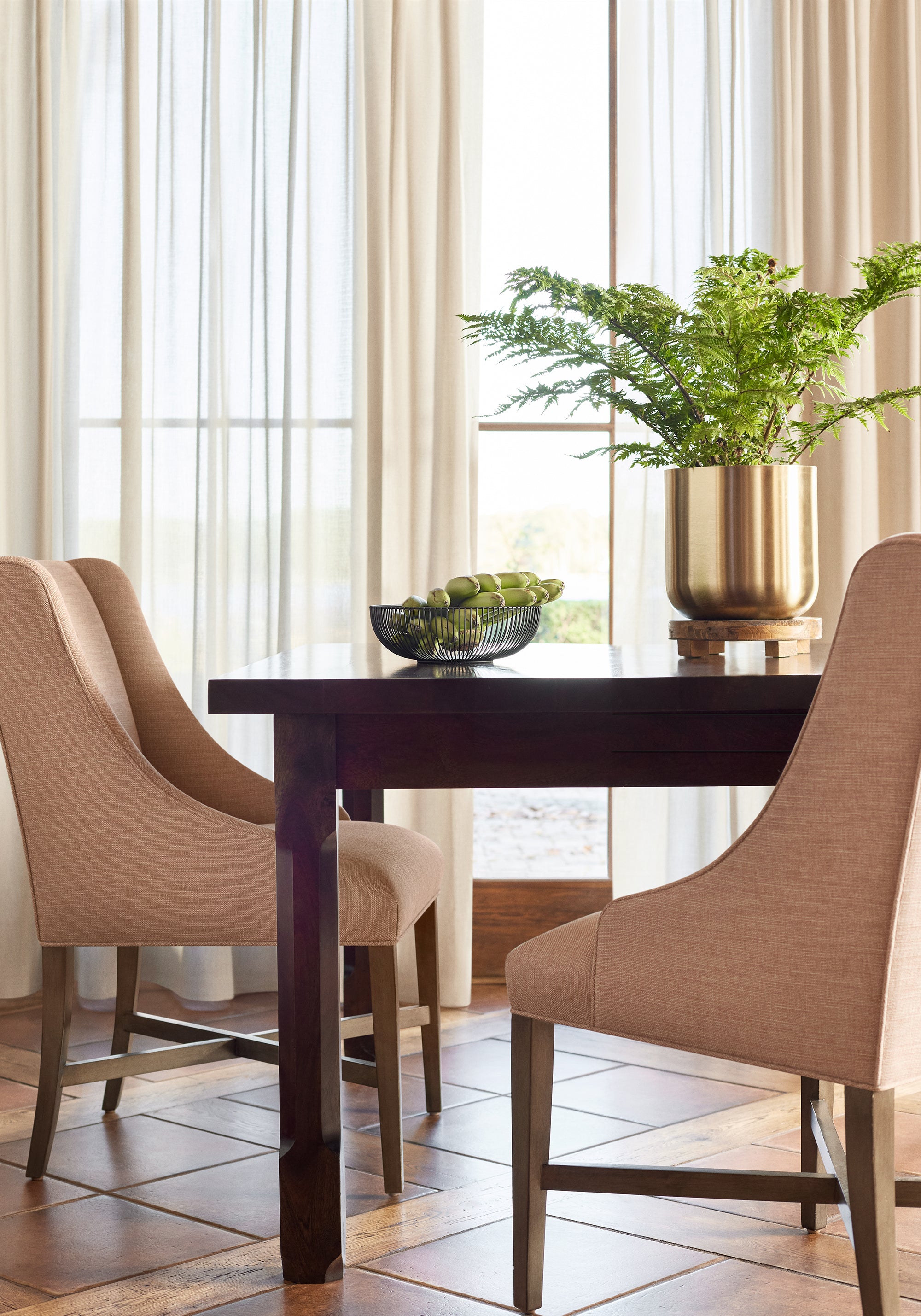 Dining room with curtains made using Daphne fabric in flax color - pattern number FWW81730 - by Thibaut fabrics