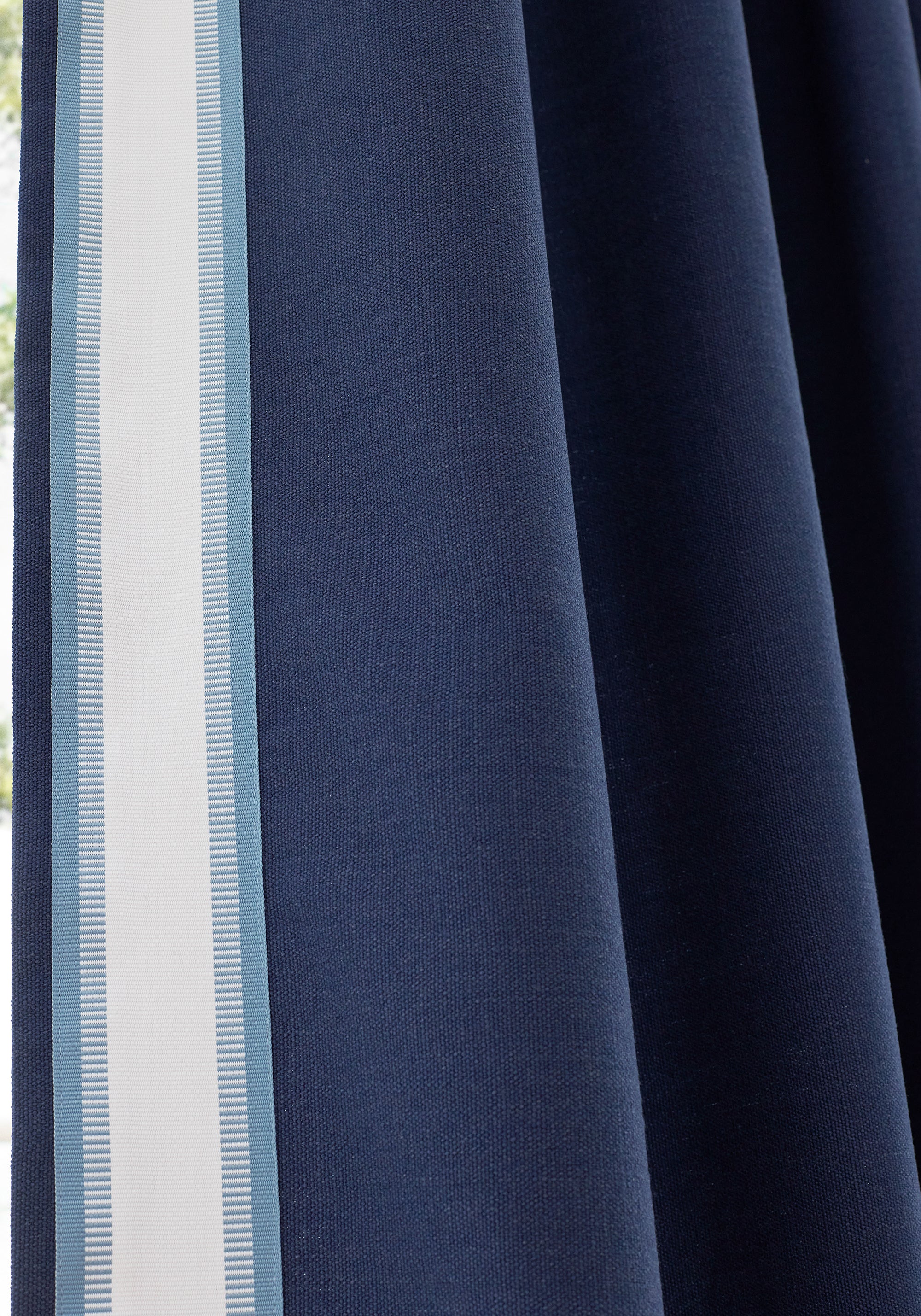 Close up of curtains made from Liam fabric in navy color - pattern number FWW81755 - by Thibaut