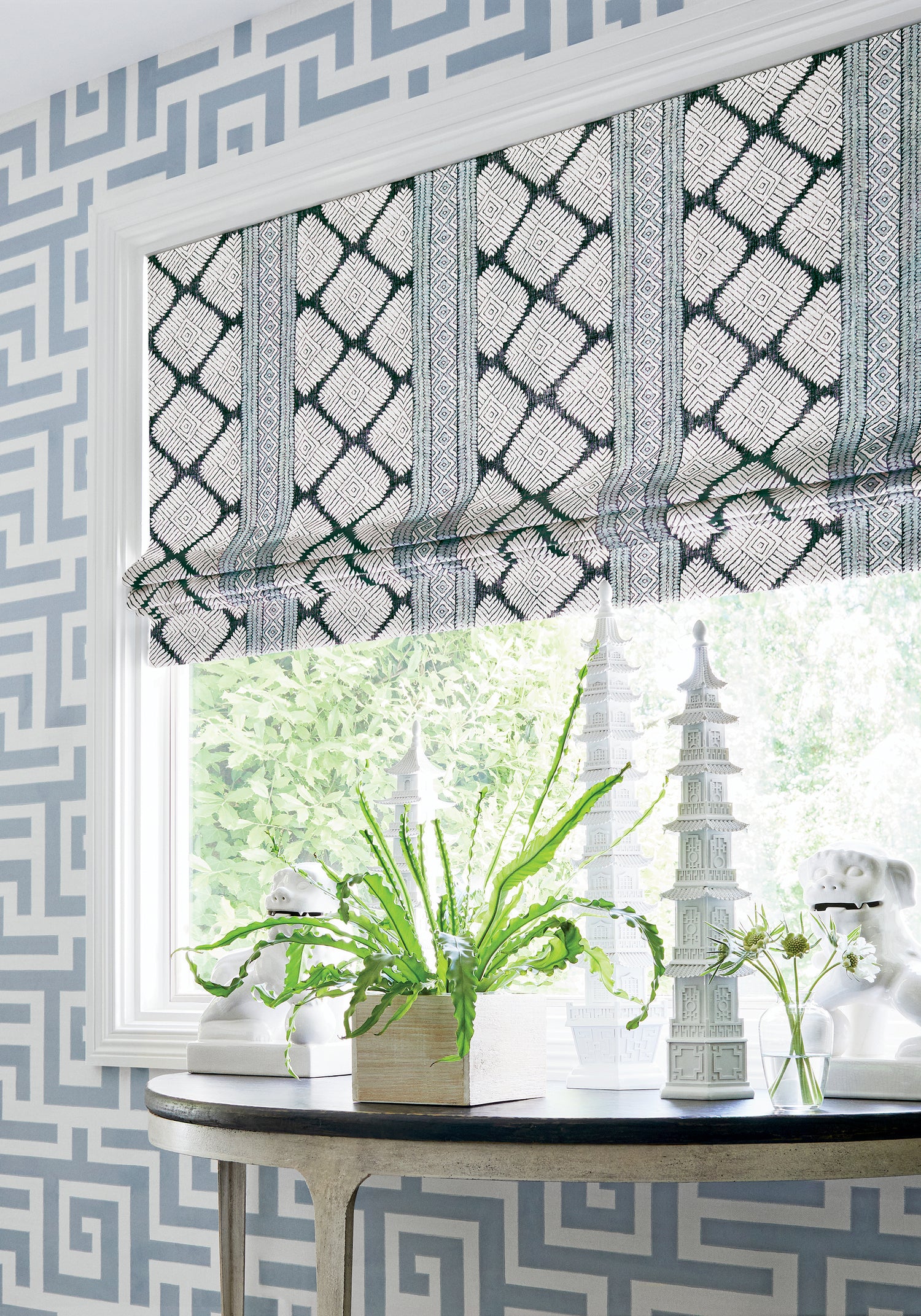 Roman shades in Austin printed fabric in black and mineral blue color - pattern number F913250 by Thibaut in the Mesa collection