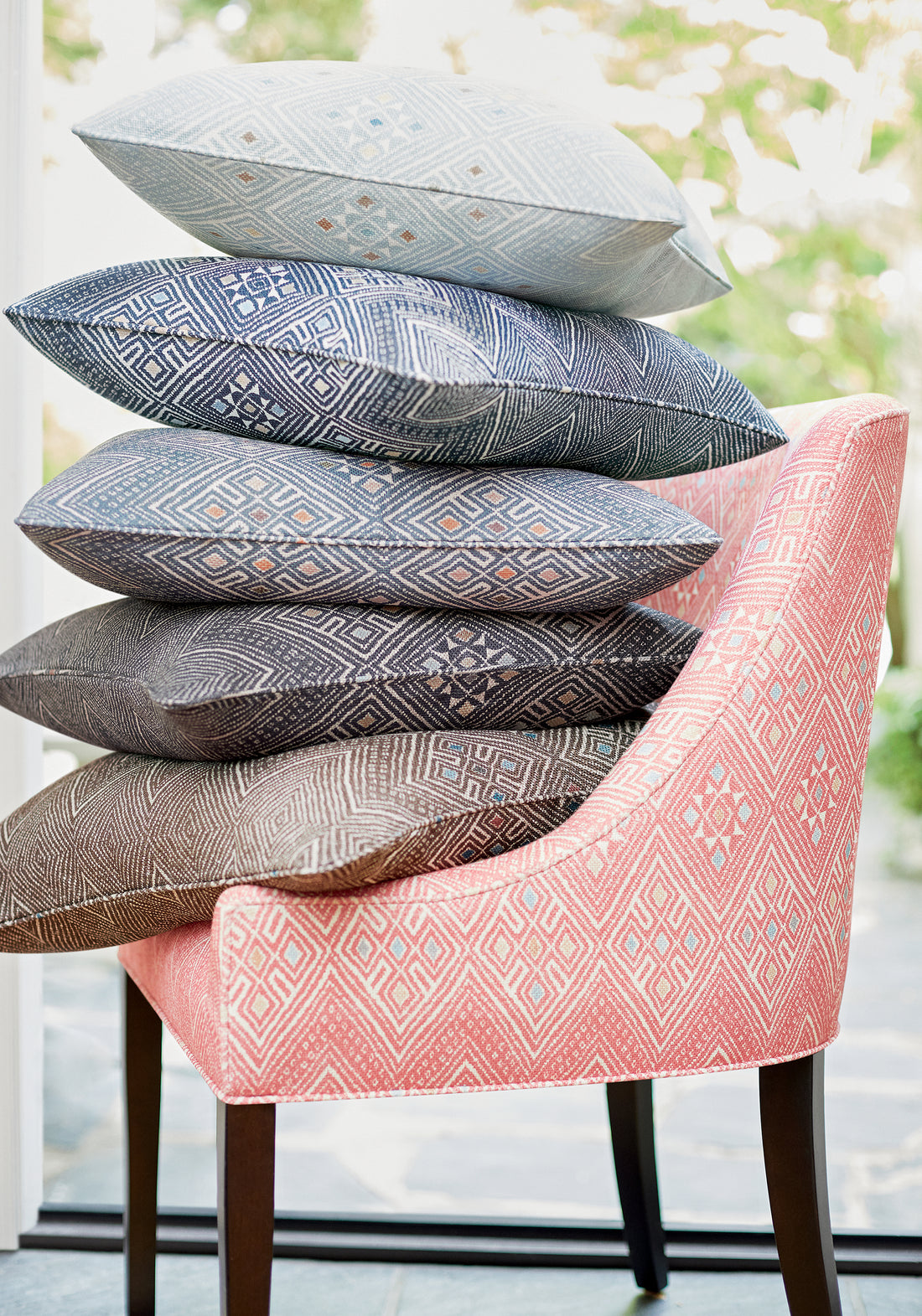 Morgan Dining Chair and collection of High Plains printed fabric pillows featuring bluestone color fabric - pattern number F913227 - by Thibaut in the Mesa collection