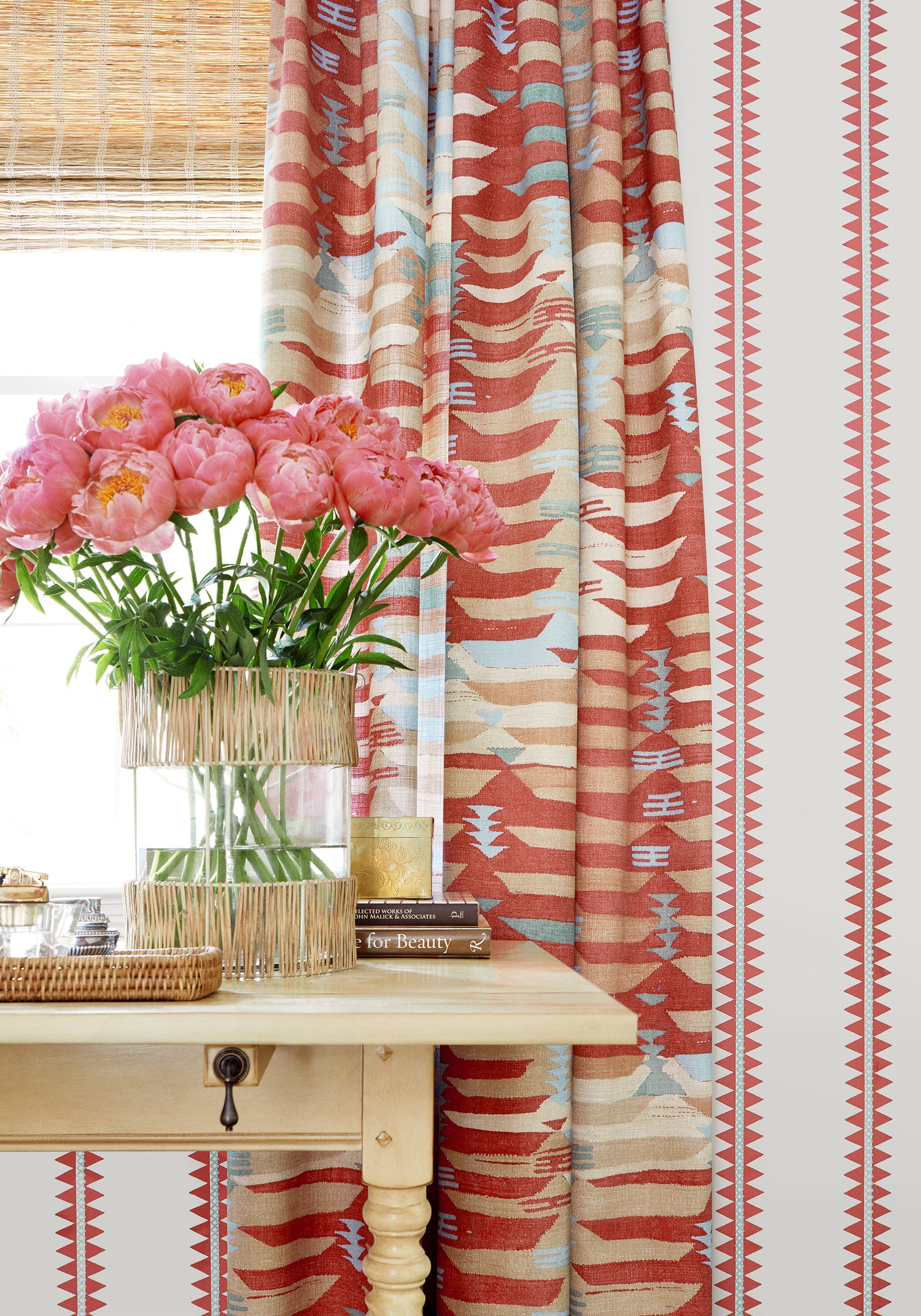 Draperies in Rio Grande printed fabric in coral color - pattern number F913212 by Thibaut in the Mesa collection