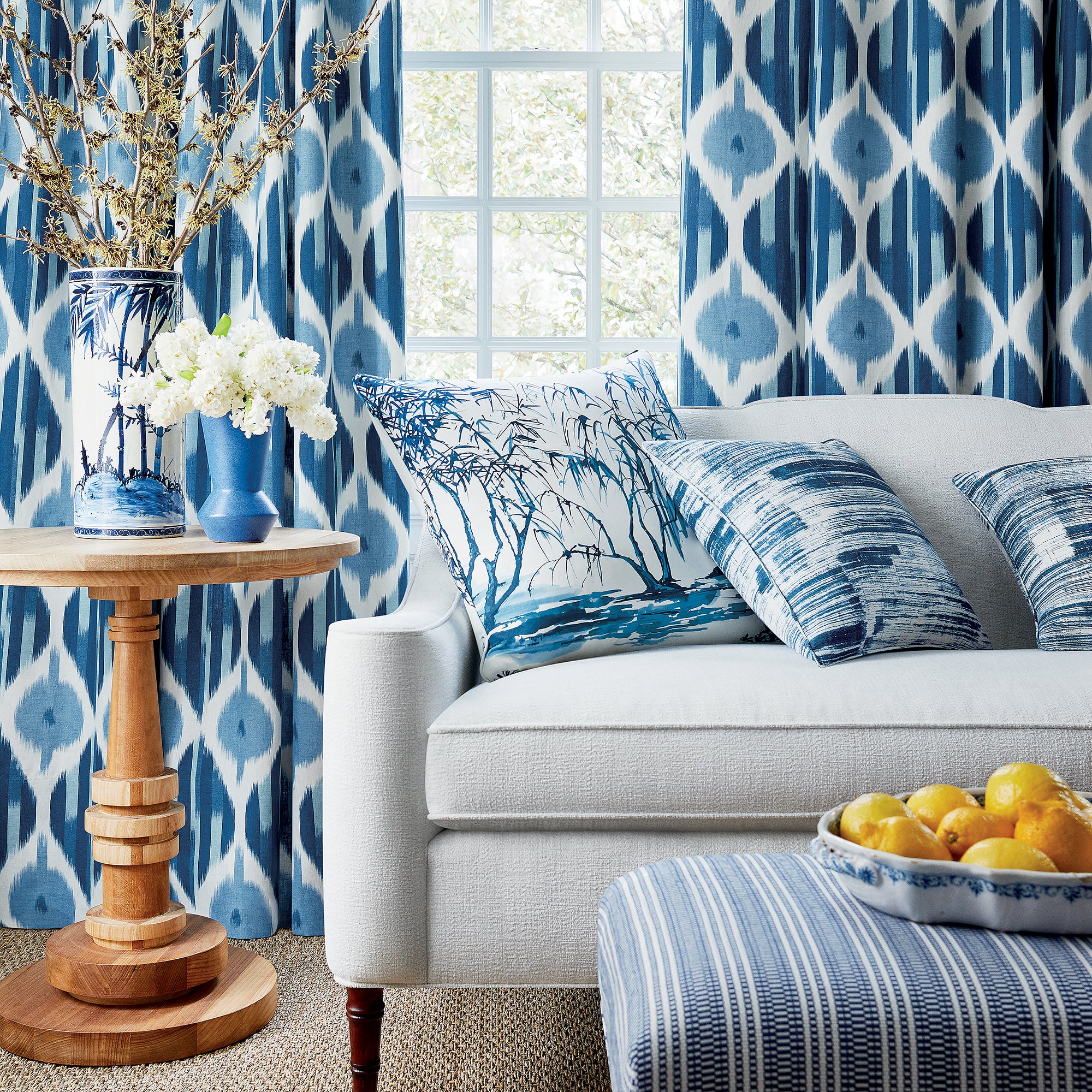 Living room with draperies in Kimono fabric in navy color - pattern number AF9855 - by Anna French in the Nara collection