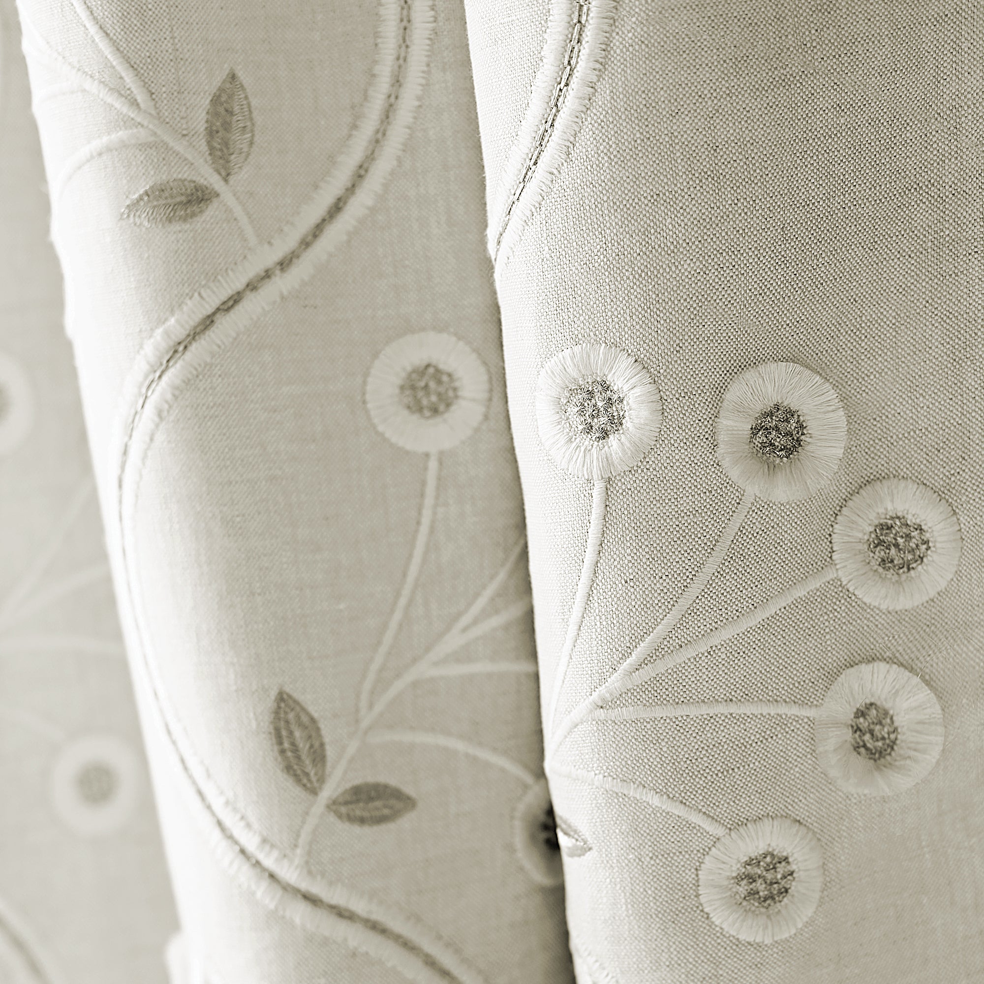 Closeup of draperies made from Olympus Embroidery fabric in natural color - pattern number AW9100 - by Anna French