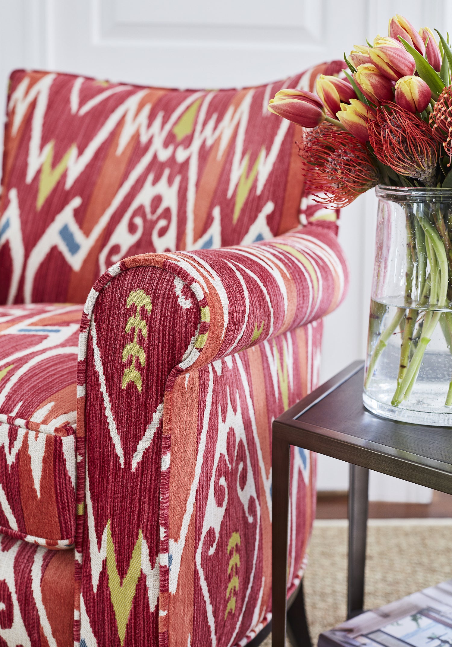 Detailed view of Winston Chair in Nomad woven fabric in red color variant by Thibaut in the Nomad collection - pattern number W73369