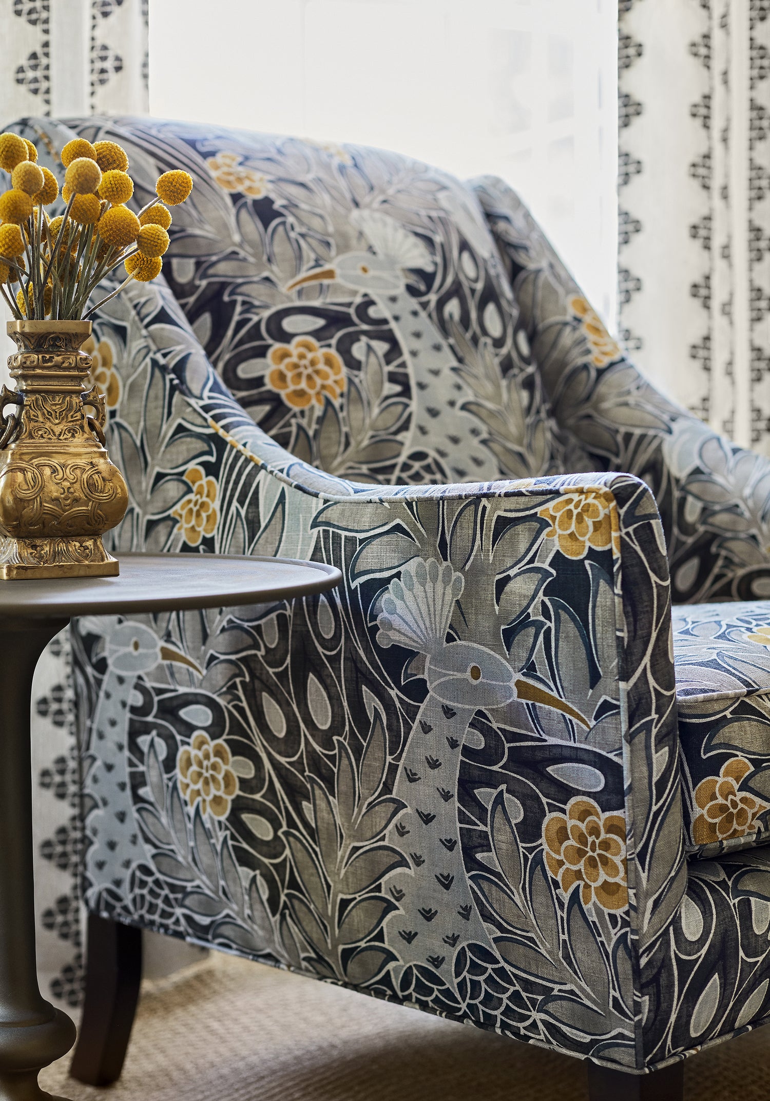 Detailed view of Shelton Wing Chair in Desmond printed fabric in black and charcoal color variant by Thibaut in the Paramount collection - pattern number F92919