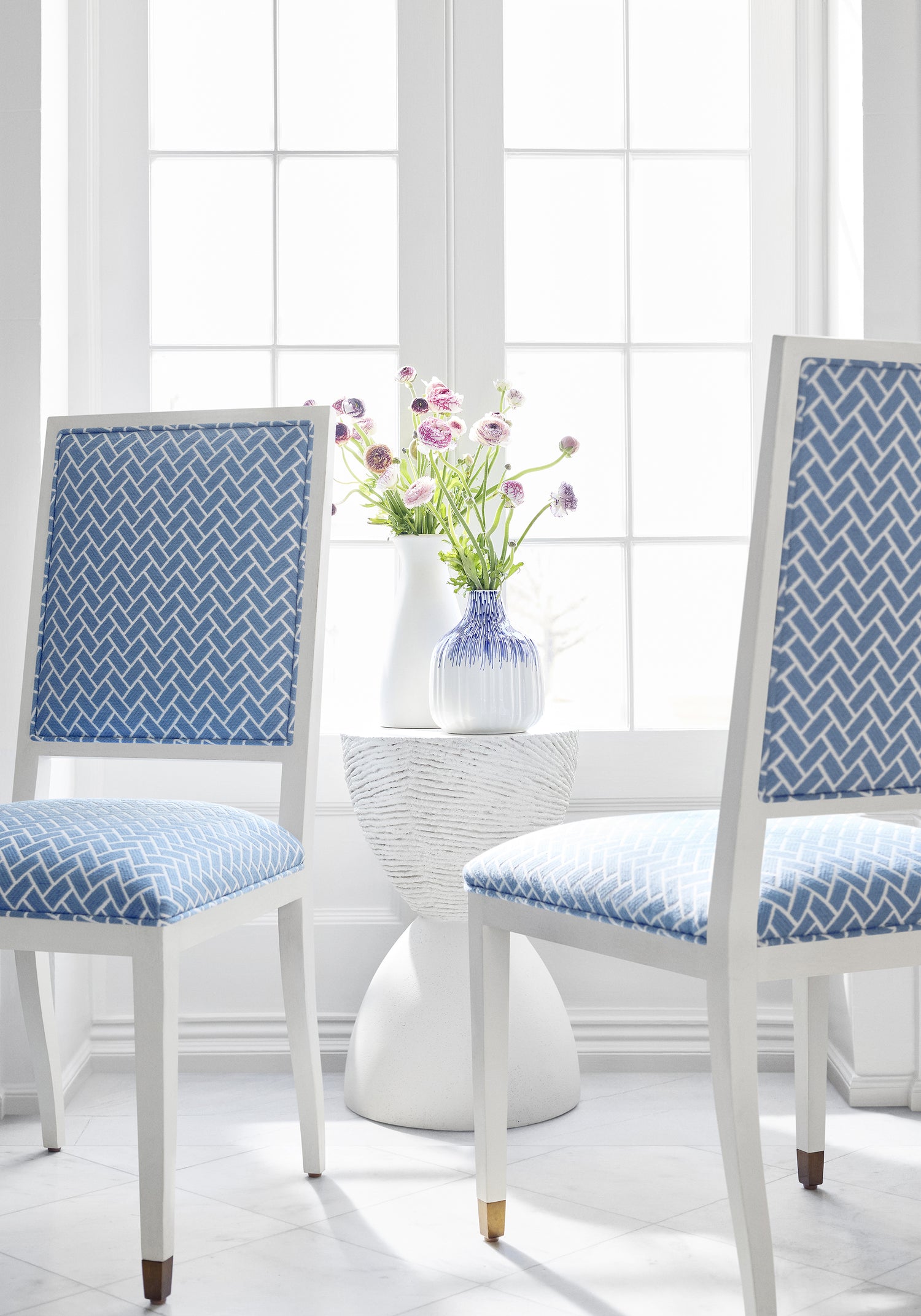 Lauderdale dining chairs in Thibaut Cobblestone woven fabric in Cornflower