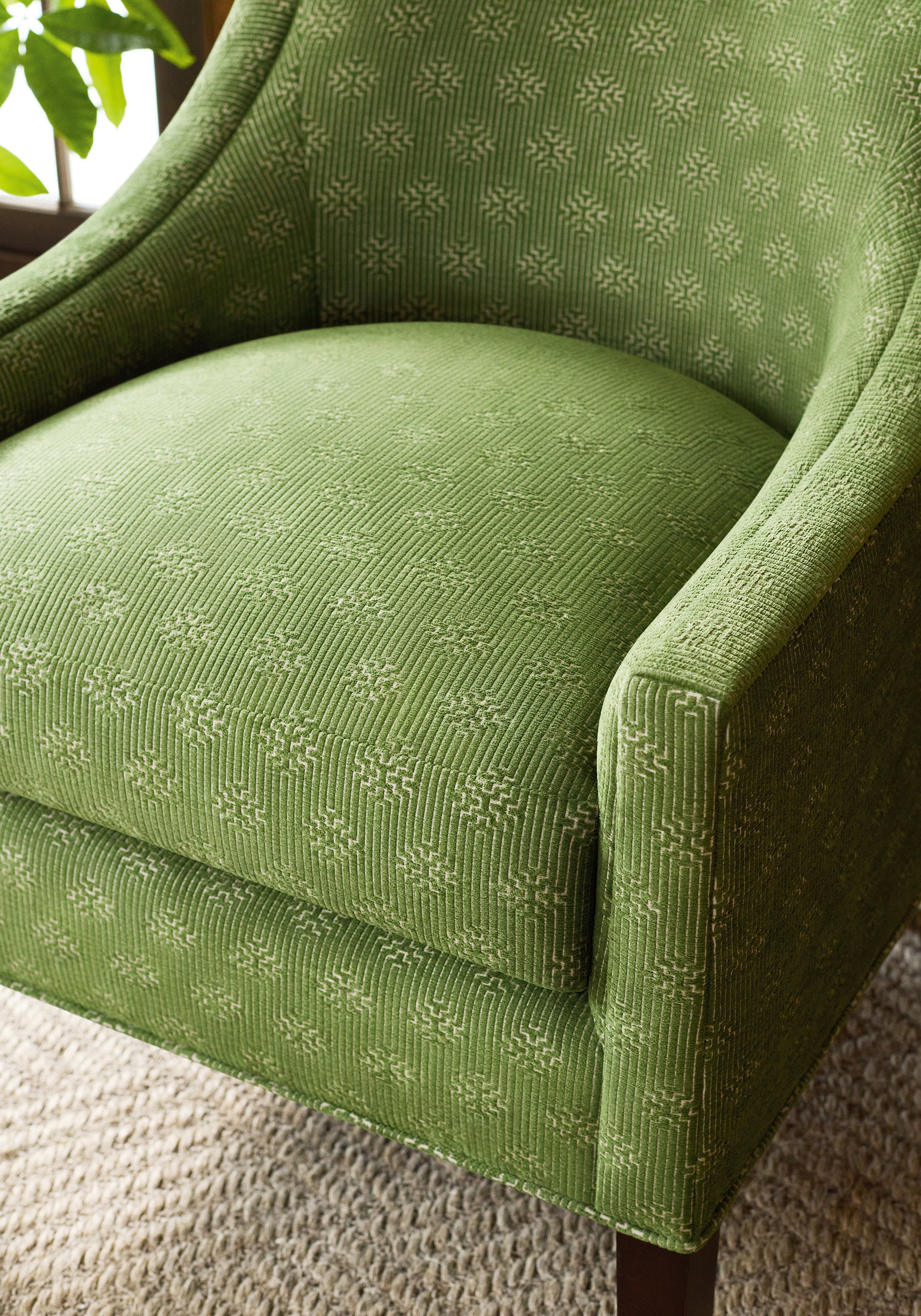 Closeup of everett chair in Crete woven fabric in olive color - pattern number W74211 - by Thibaut fabrics