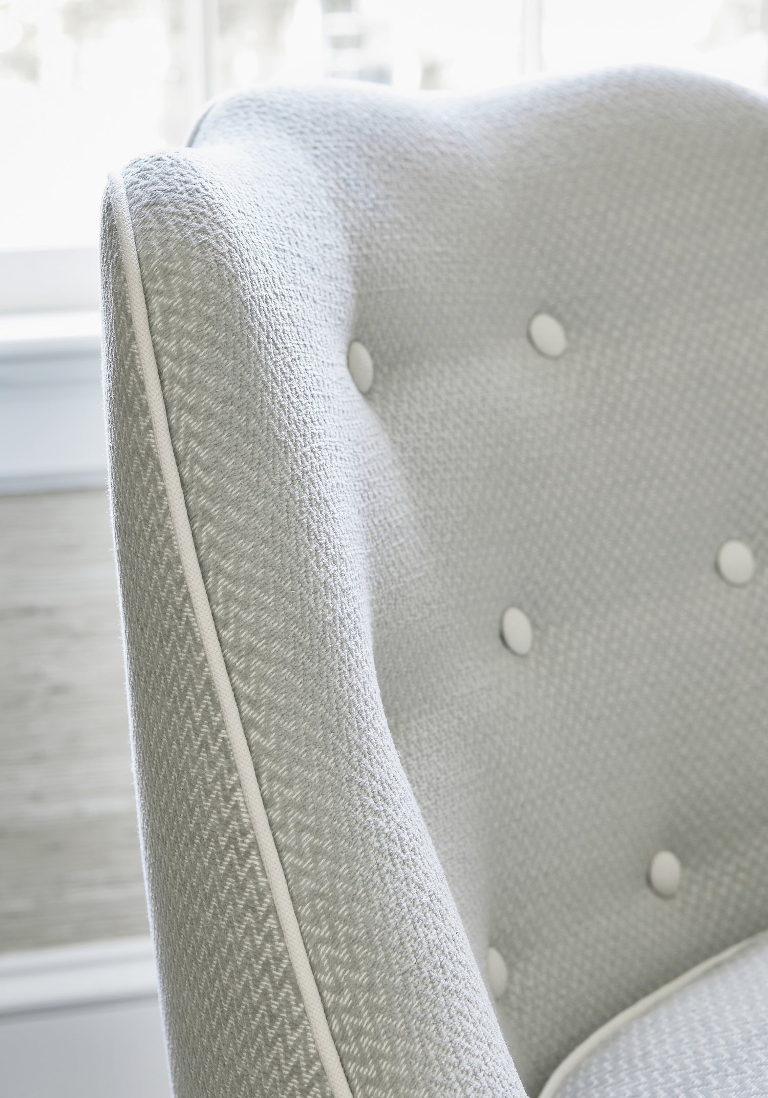 Detailed view of Brentwood Chair in Alpine Chevron woven fabric in fog color variant by Thibaut in the Pinnacle collection - pattern number W80654