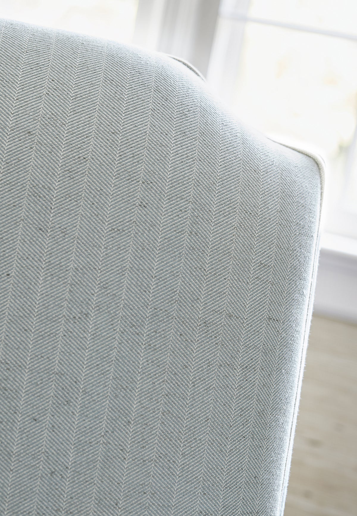 Detailed view of Charlotte Chair in Hamilton Herringbone woven fabric in aqua color variant by Thibaut in the Pinnacle collection - pattern number W80671