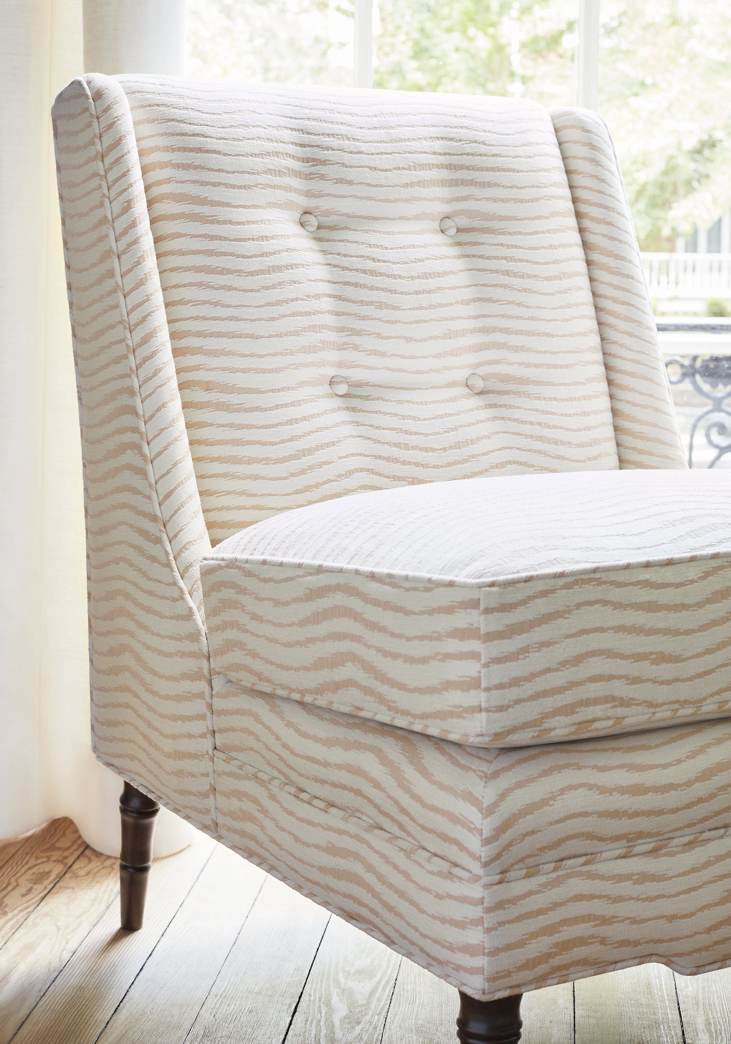 Detail of Bedford Chair in Capri woven fabric in blush color of the Reverie collection by Thibaut - pattern number W789150