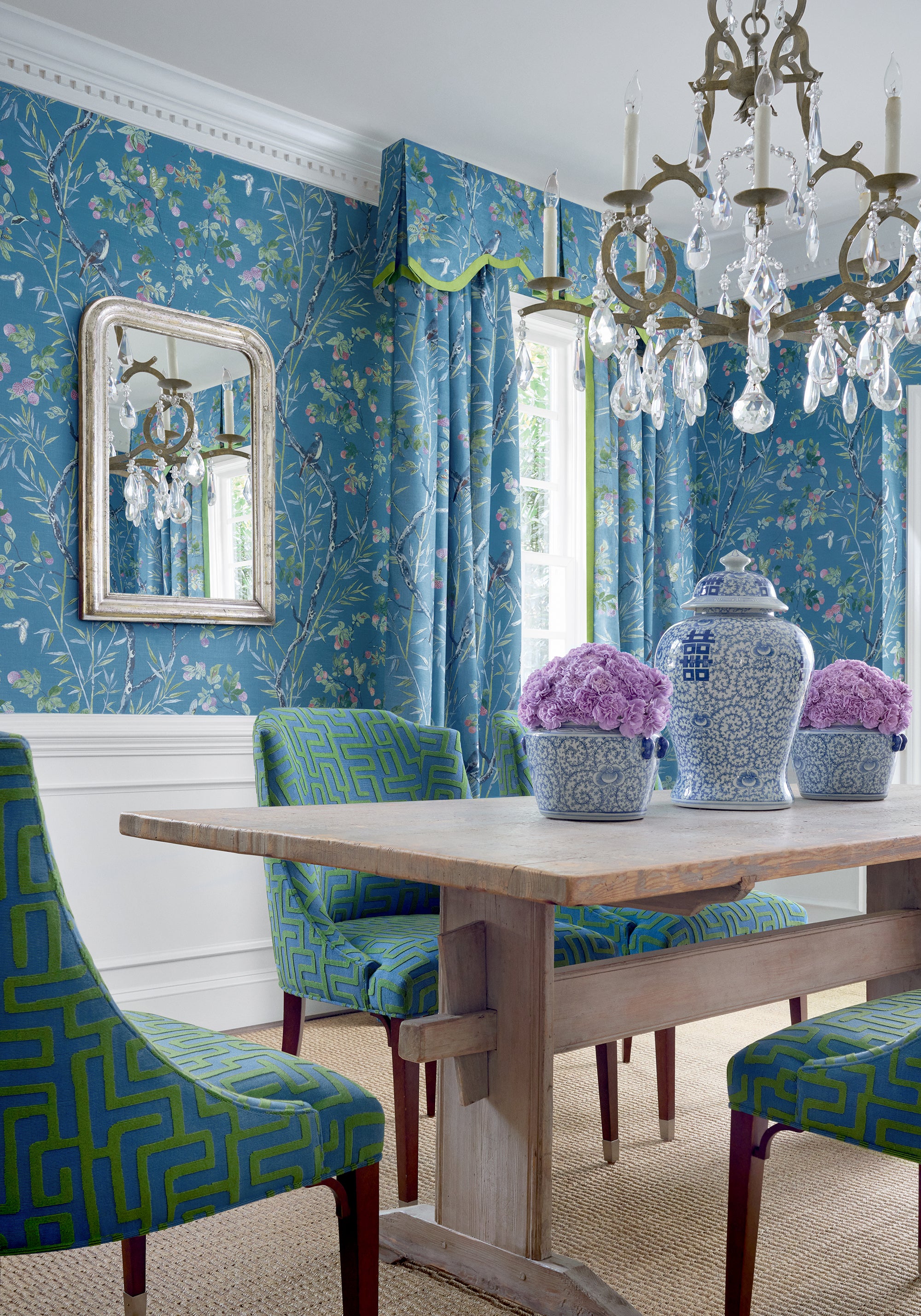 Dining room with curtains made with claire printed fabric in Navy color pattern F942008 by Thibaut fabrics