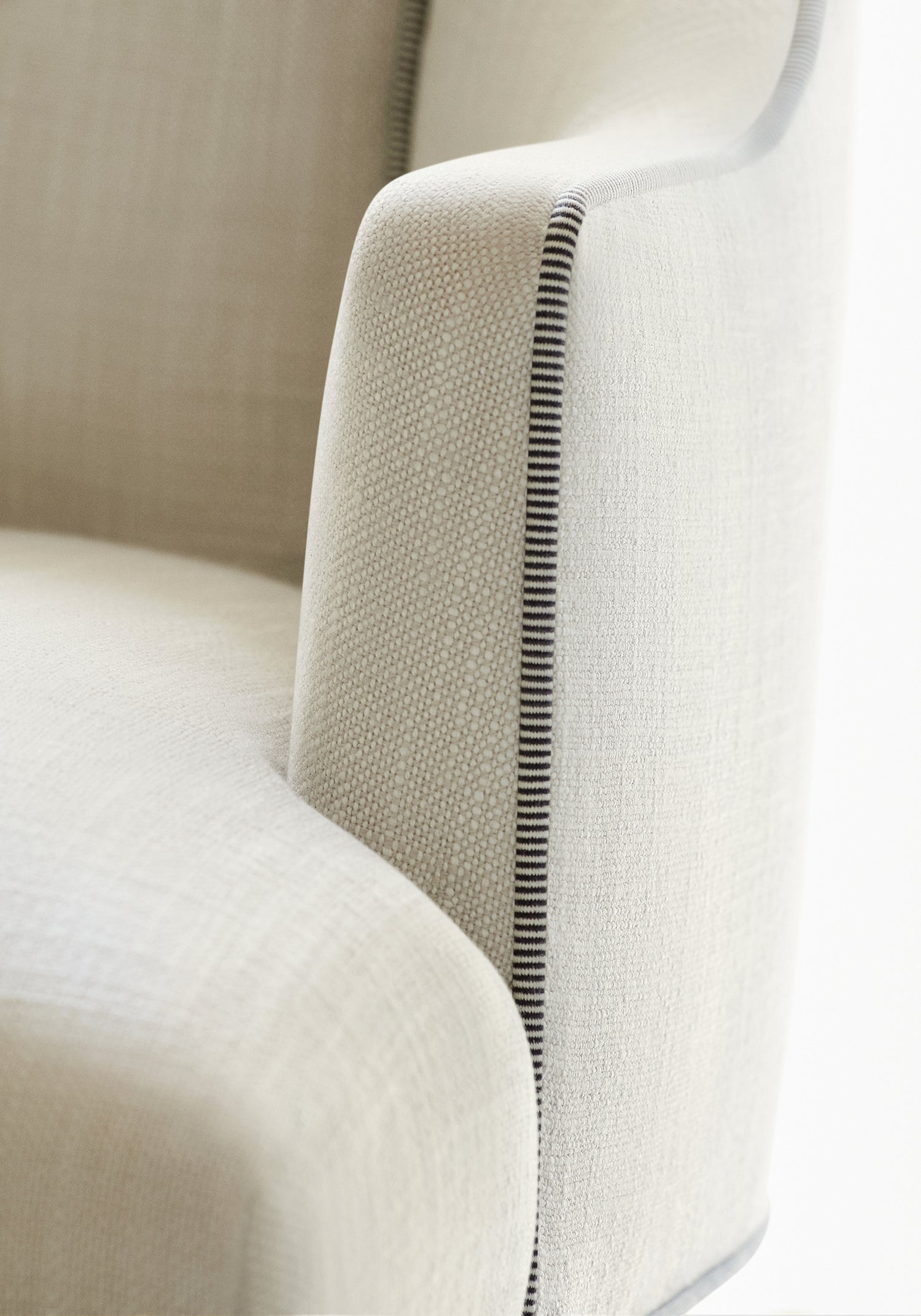 Detail of Palisades Dining Chair in Bristol woven fabric in flax color with onyx trim - pattern number W73416 - by Thibaut in the Landmark Textures collection