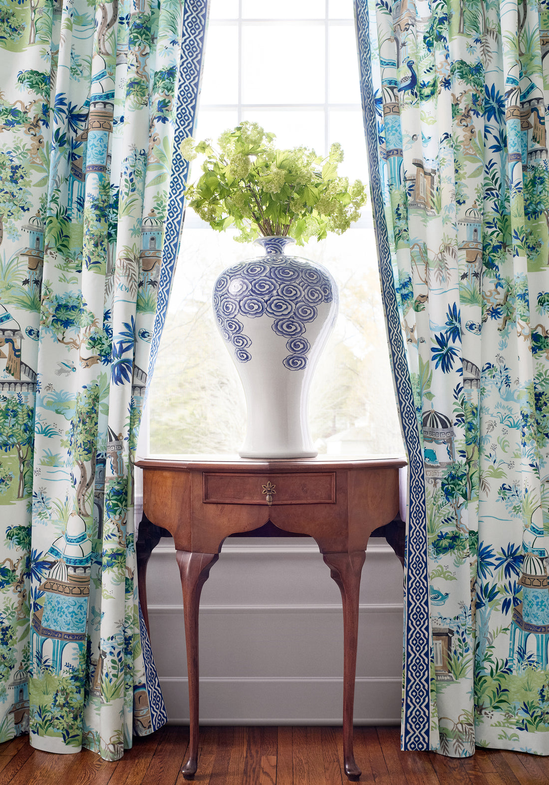 Draperies in Mystic Garden printed fabric in blue and green color - pattern number F920820 by Thibaut in the Eden collection