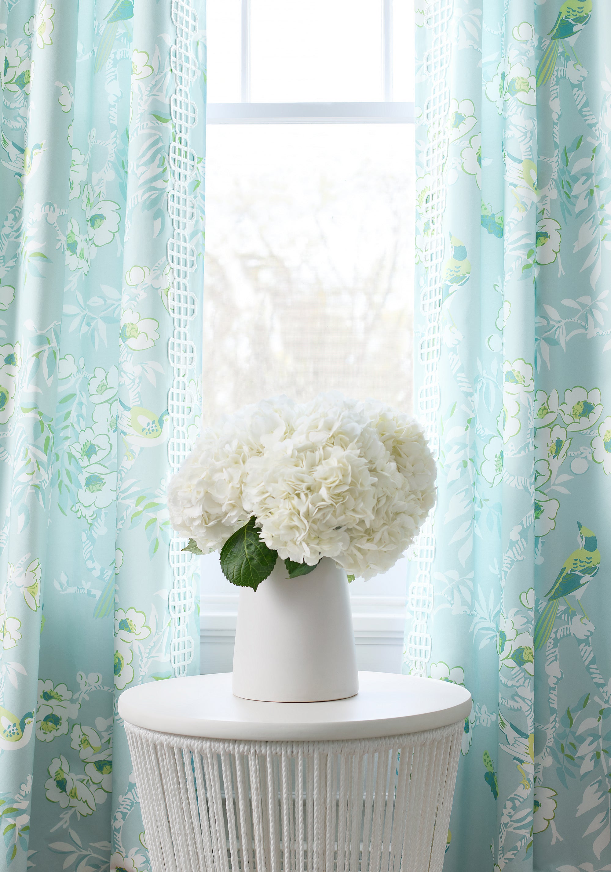 Draperies in Yukio printed fabric in spa blue color - pattern number F920843 by Thibaut in the Eden collection