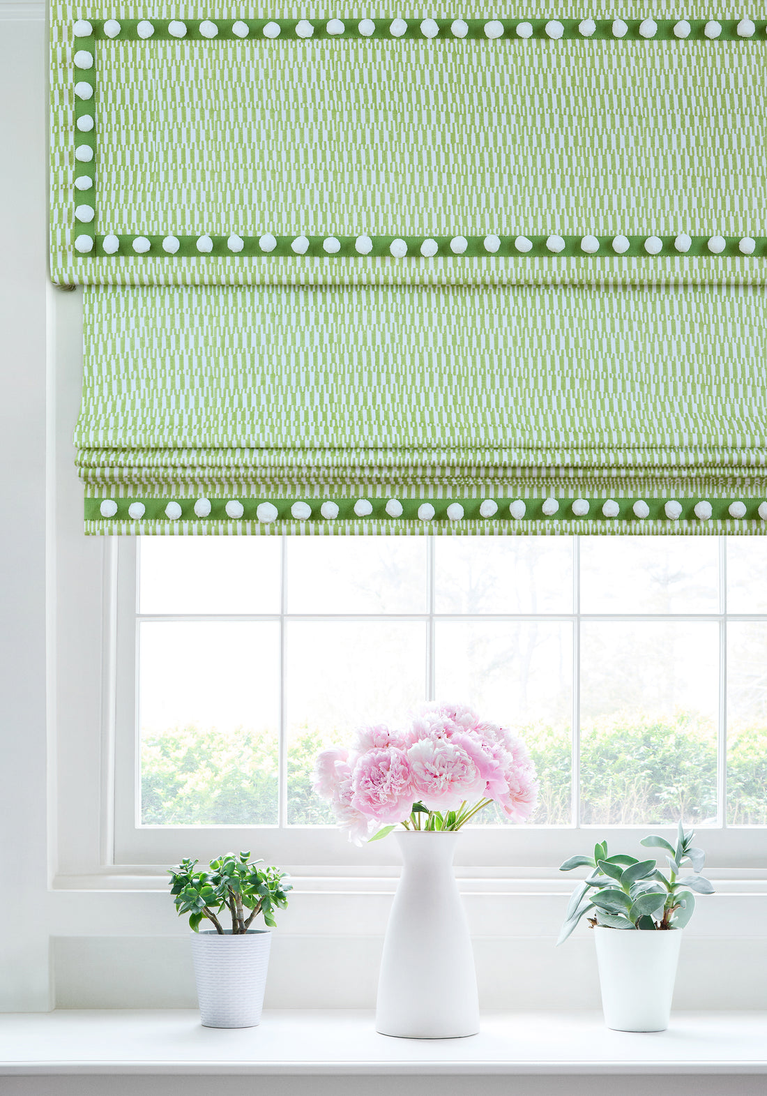 Roman shade in GoGo woven fabric in parrot green with Pom Pom Tape in kelly trim - pattern number F920800 - by Thibaut in the Eden collection