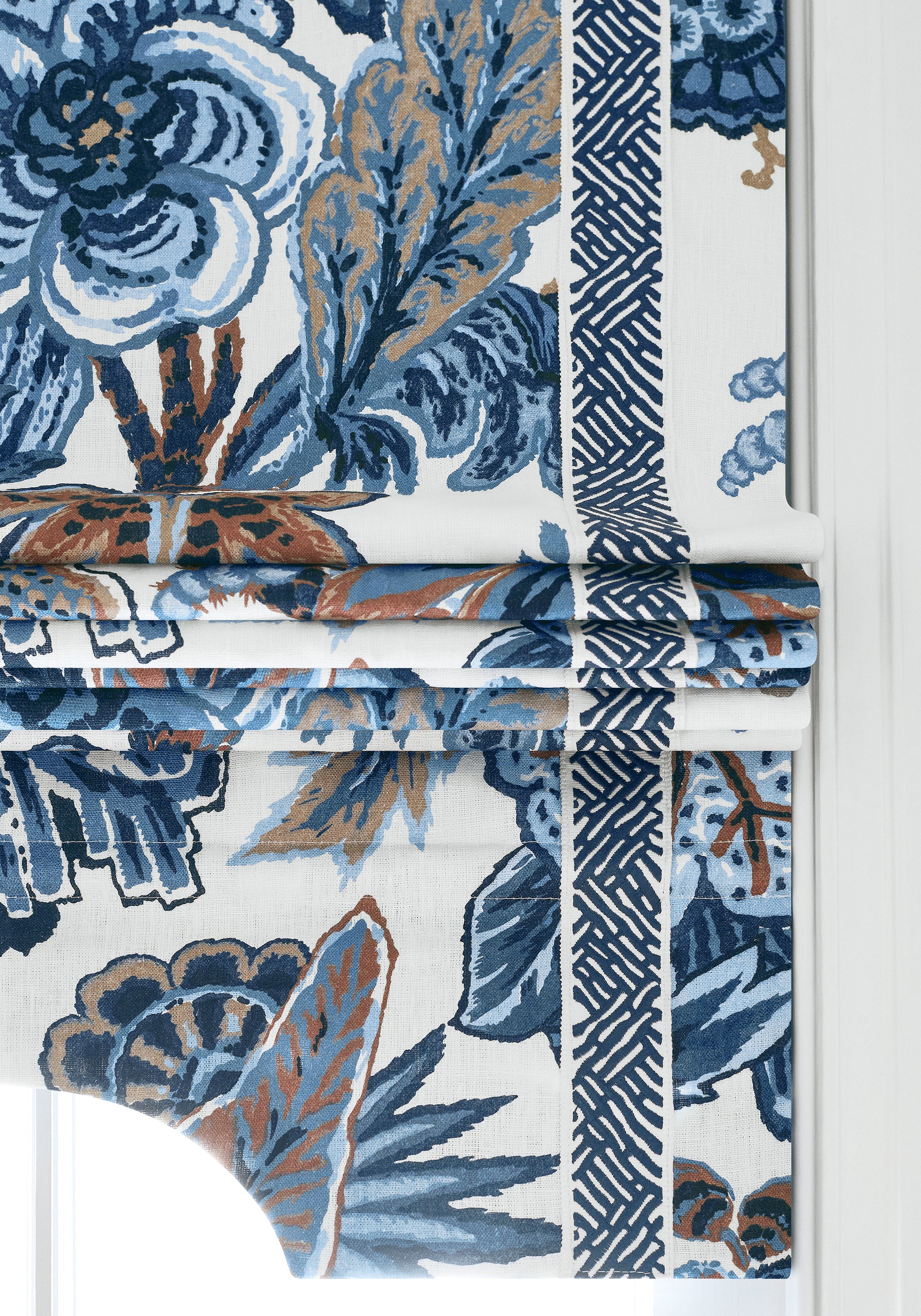 Detailed view of Roman shade in Floral Gala printed fabric in navy and white color variant by Thibaut in the Colony collection - pattern number F910213