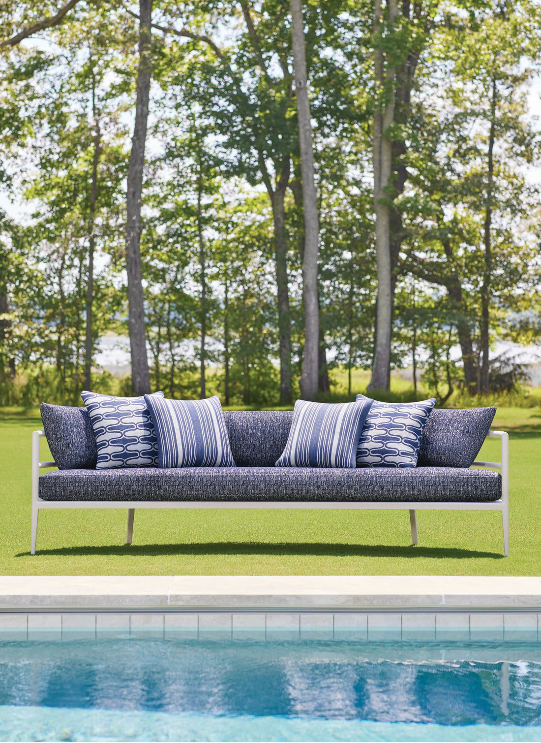 Chair cushion and end pillows in Cestino fabric in navy color - pattern number W8522 - by Thibaut in the Villa collection