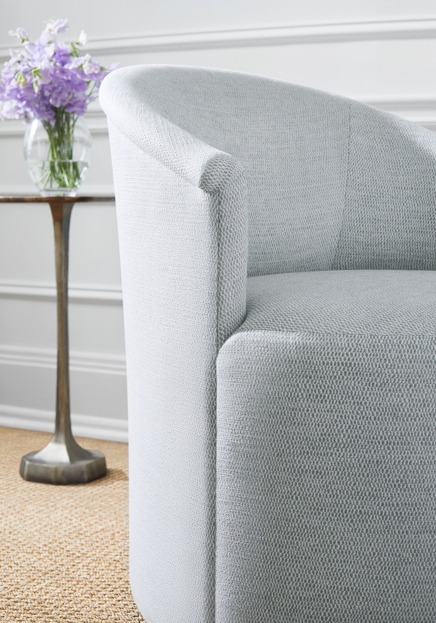 Detailed view of Ashby Chair with Swivel in Rito woven fabric in fog color - pattern number W8116 by Thibaut in the Sereno collection