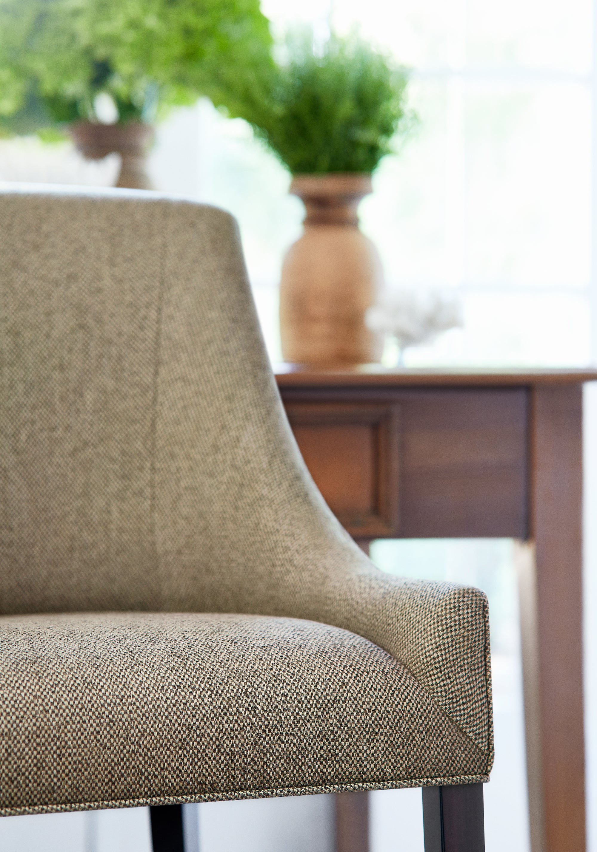 Detailed view of Morgan Dining Chair in Tinta woven fabric in mocha color - pattern number W8129 by Thibaut in the Sereno collection